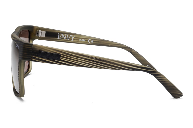 Side view of a pair of Liive Envy Polar Sunglasses featuring a dark brown, woodgrain-like pattern on the frame and the word "ENVY" inscribed on the arm. These sunglasses offer UV protection and boast a sleek, modern design with slightly angled temples for added comfort.