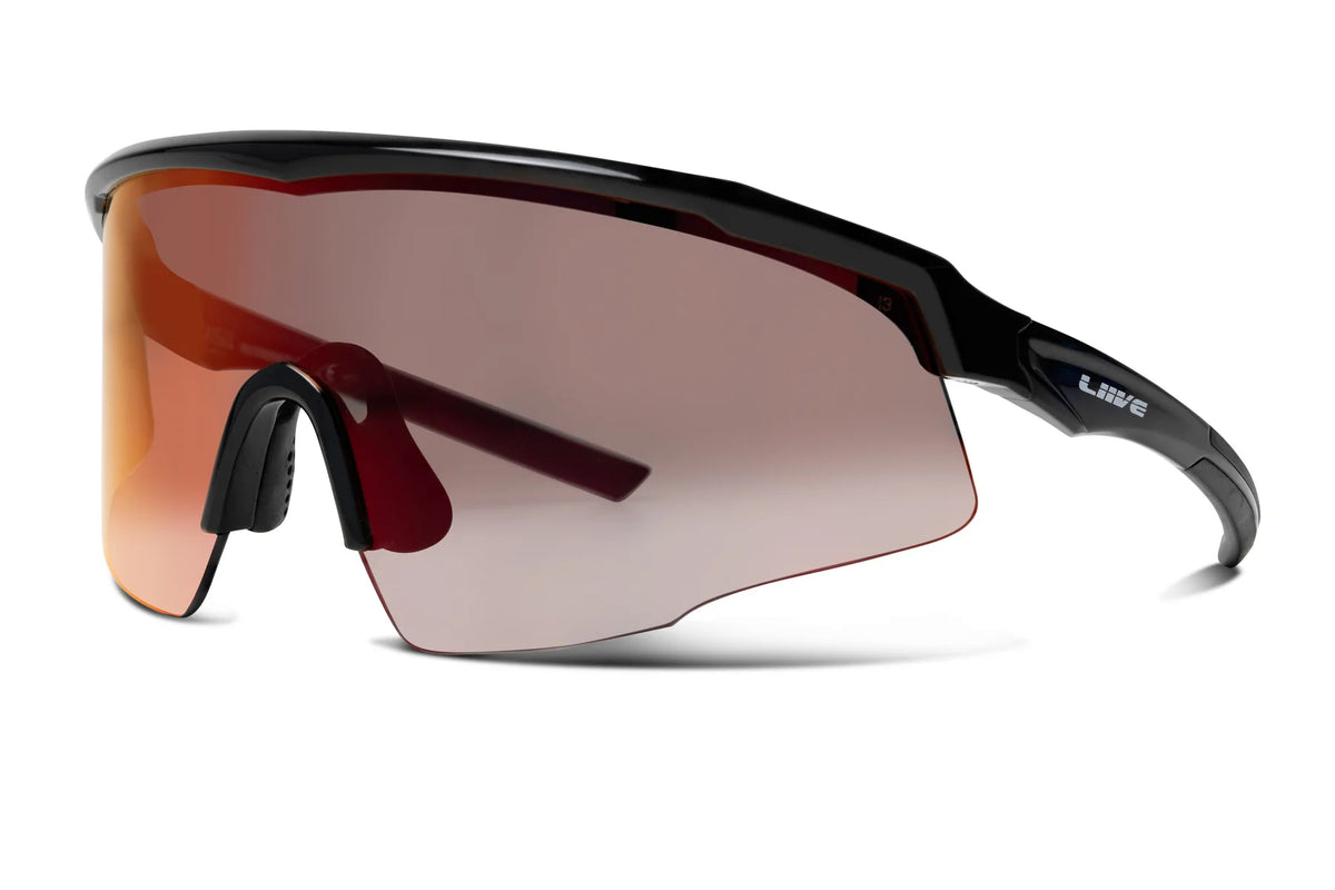 The Liive Z Chisel Safety Mirror Sunglasses are sleek, sporty wraparound sunglasses with shatterproof, UV-protective lenses in a brown gradient. Featuring a continuous lens, black frame, and adjustable nose pads, they offer a lightweight build ideal for active use.