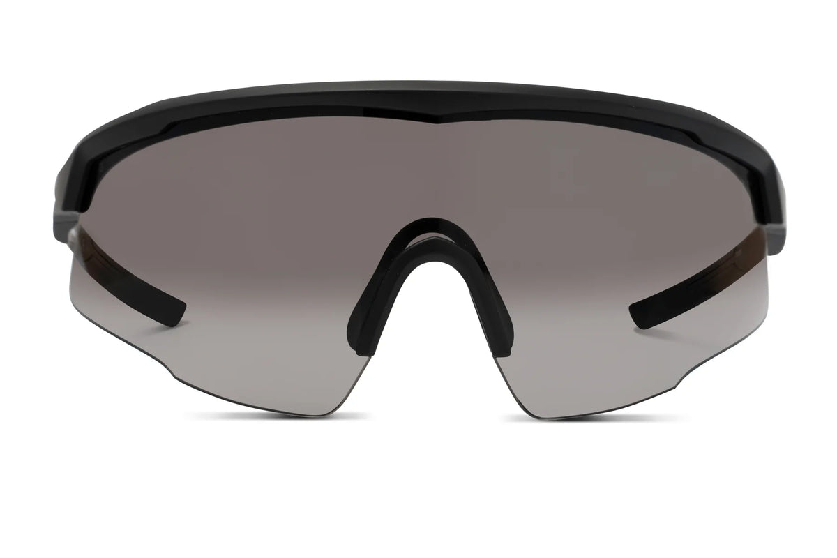 The Liive Z Chisel Safety Sunglasses are sleek and frameless with a black top frame, smoke-tinted UV-protected lenses. Their shatterproof, aerodynamic design offers wide coverage, making them the ideal stylish and functional choice for outdoor activities.