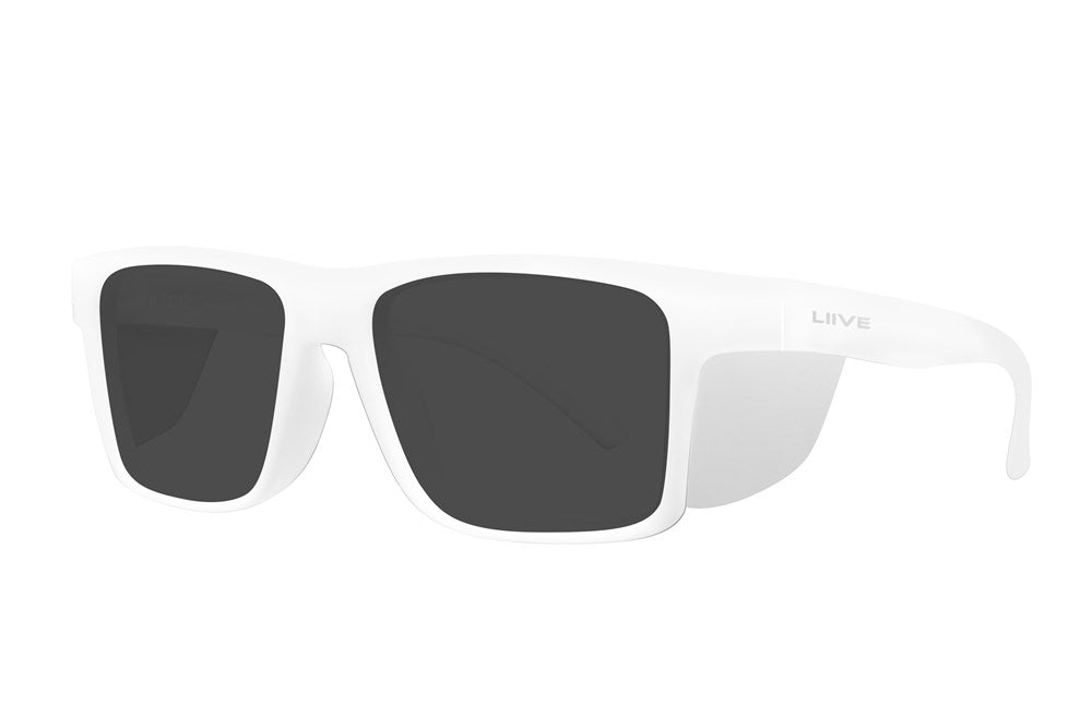 The Liive Z Tradie Safety Sunglasses are displayed in a three-quarter view, featuring white frames and dark, shatterproof lenses with the "Liive" brand subtly visible on the side, combining a sleek and modern design with style and UV protection for sunny days.