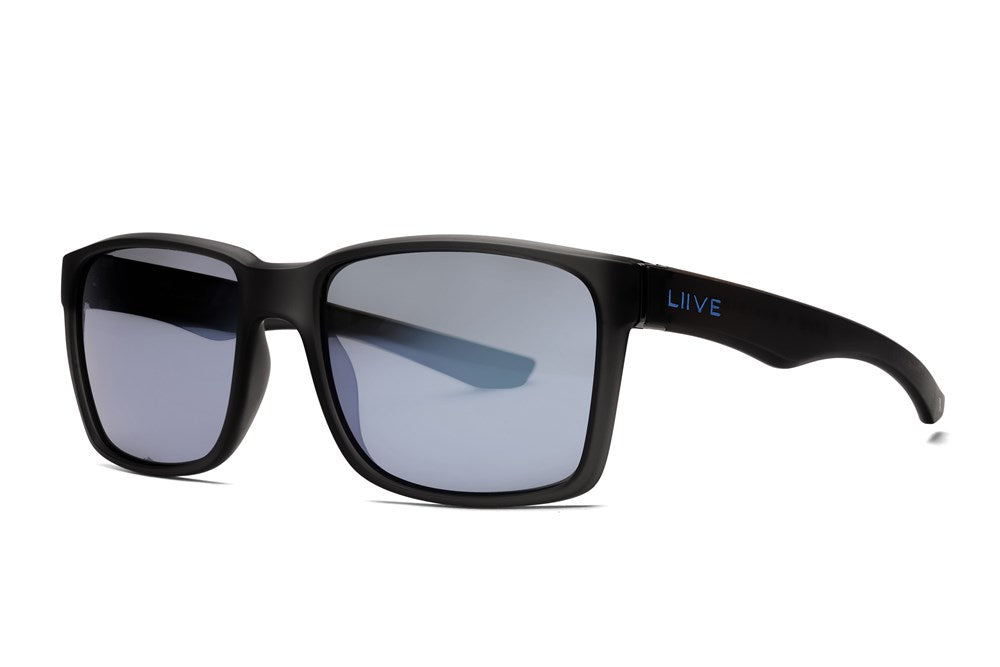 The Liive X Outlaw X Photochromatic Sunglasses boast a sleek black frame with reflective grey lenses. "LIIVE" is in blue text on the left temple arm. Designed with hydrophobic and oleophobic coatings, they're perfect for any adventure.