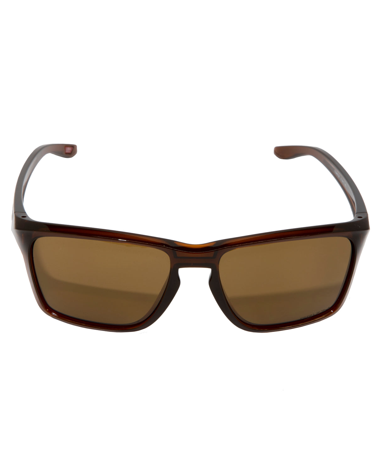 A pair of Oakley Sylas sunglasses featuring a polished Rootbeer frame, dark brown rectangular lenses with Prizm technology for enhanced clarity, and slightly curved temples is displayed against a white background.