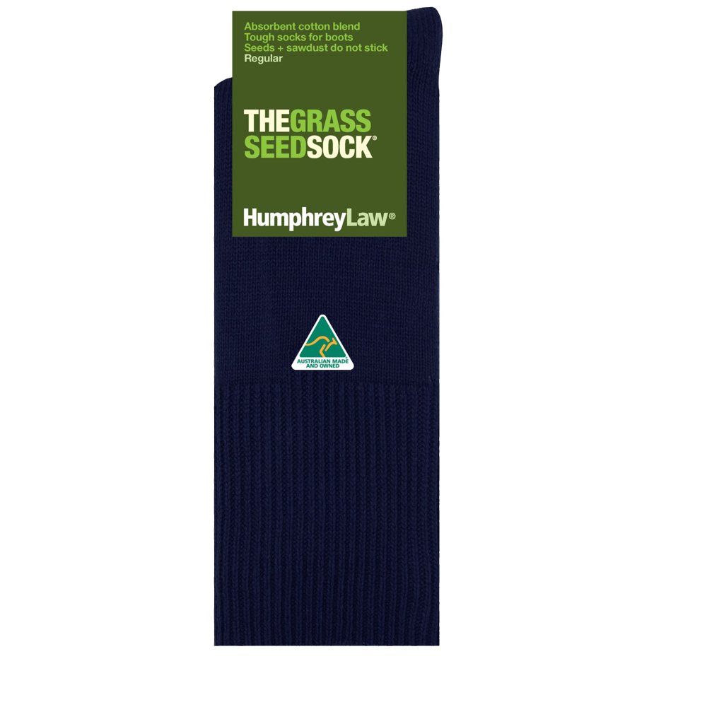 A short dark blue sock with a green label at the top reads "THE GRASS SEED SOCK" by Humphrey Law. The label highlights the "absorbent cotton blend" and states that "seeds & sawdust do not stick." Made in Australia, this sock also features a small emblem below the text.