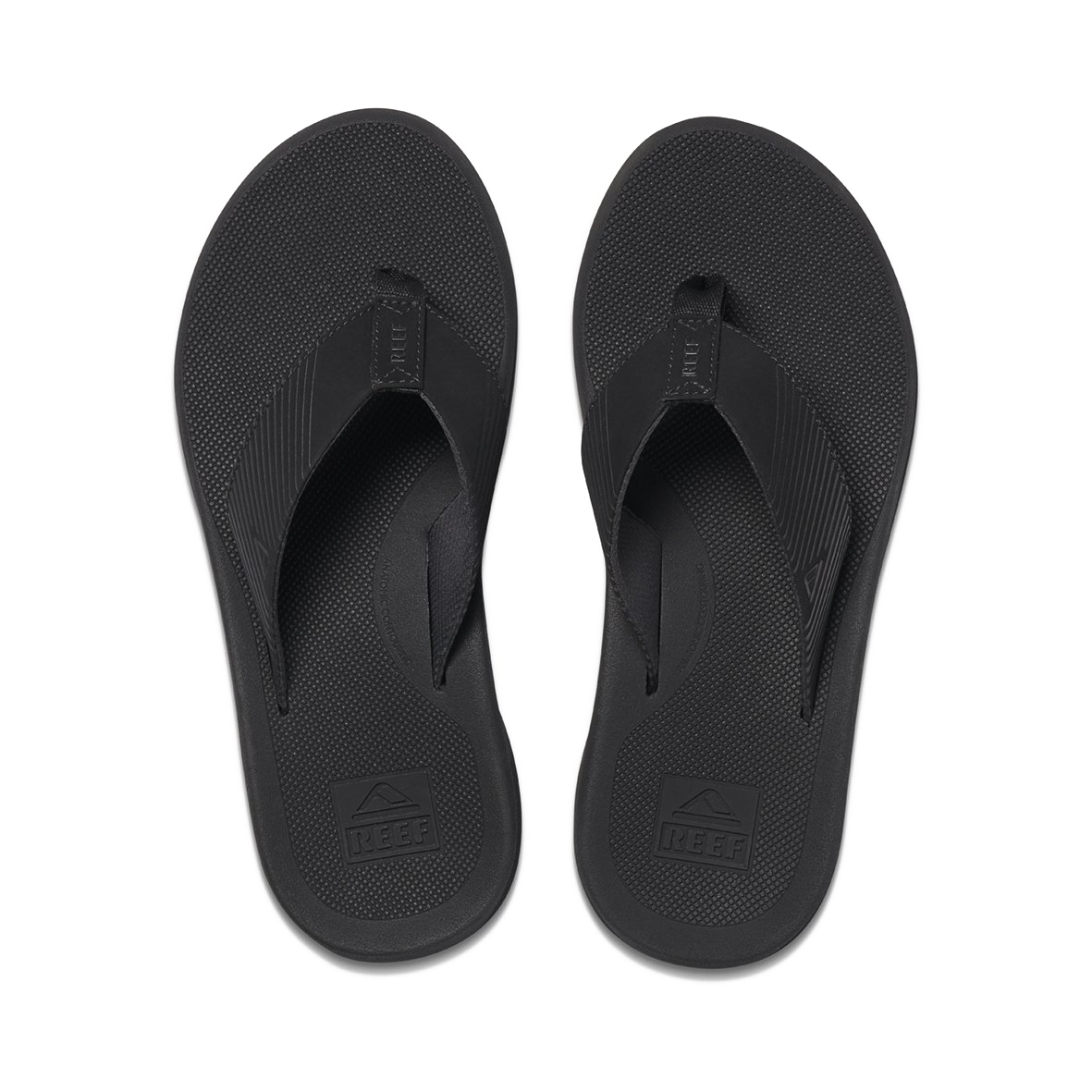 The REEF Phantom II flip-flops come in black, featuring textured soles and straps with enhanced arch support for added comfort. The brand logo is visible on the insole near the heels, and a small logo is embossed on the straps. These supportive thongs have a simple, minimalist design, making them perfect for water-friendly adventures.