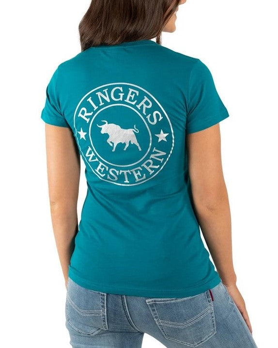 A person is wearing a Ringers Western Women's Signature Bull Classic Fitted T-Shirt in teal, made of 100% cotton, with white text and a bull logo on the back that reads "Ringers Western." The person is facing away, revealing their jeans back pockets.