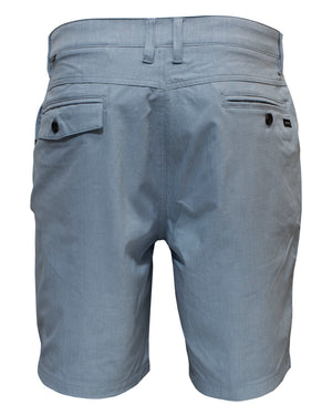 The Rip Curl Boardwalk Oceanside Short, a pair of stylish and comfortable light gray men's shorts viewed from the back, features two back pockets with black buttons and belt loops along the waistband. Made from 100% polyester, the fabric has a smooth texture with a subtle sheen.