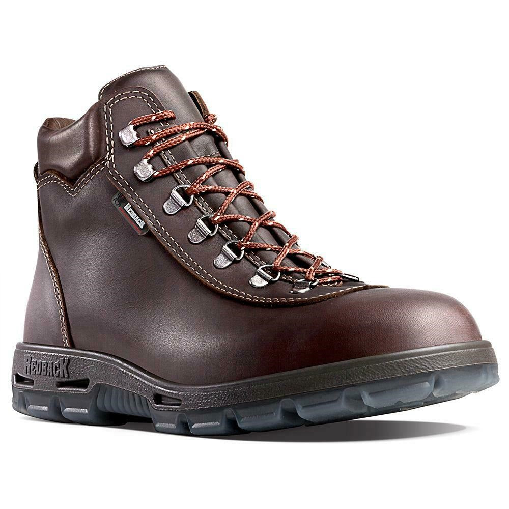 The Redback Everest Soft Toe is a brown leather hiking boot with sturdy laces, metal eyelets, padded collar, and thick rugged rubber sole, shown against a white background in UK men's sizing.