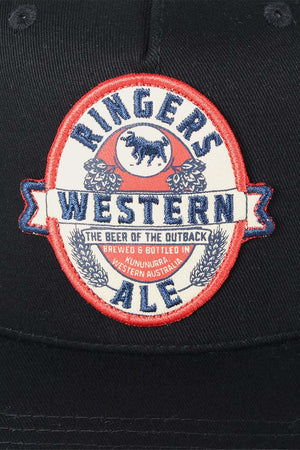 The Ringers Western Ale Trucker black hat showcases a circular patch reading "Ringers Western Ale, The Beer of the Outback," with a cow silhouette in the center. Brewed in Kununurra, WA, it features an adjustable strap and mesh back for comfort.
