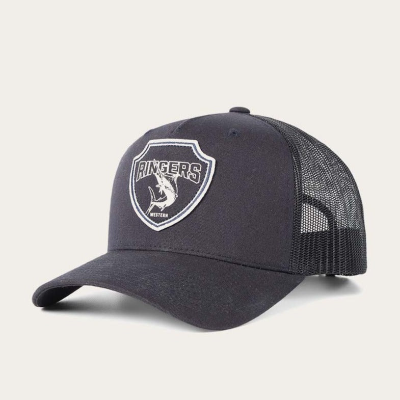 The Ringers Western Marlin Trucker hat is black with a mesh back and curved brim, featuring a shield logo with "Ringers," a bull rider illustration, and "Western" beneath it on the front. It has an adjustable strap for a perfect fit on any adventure.