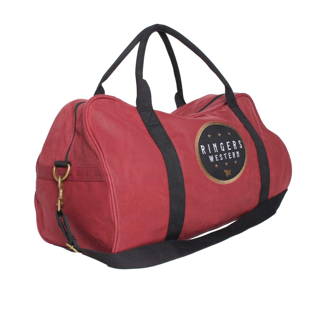 The Ringers Western Dusty Duffle Bag in red is meticulously crafted from heavy-duty waxed canvas and features black handles and straps. It includes a round logo patch on the side, encircled by stars, a zippered compartment, and a detachable black shoulder strap.