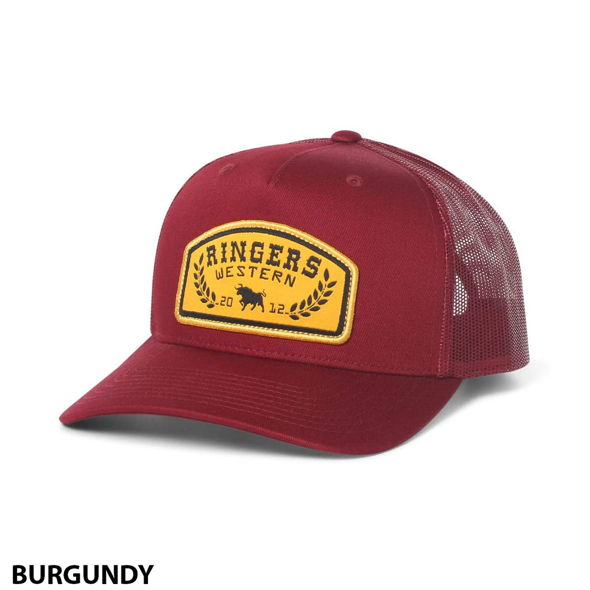 The Ringers Western Wheatbelt Trucker is a burgundy cap with a curved brim, mesh back, and a yellow front patch featuring "Ringers Western," a bear, and laurel design. "BURGUNDY" appears in black at the lower left.