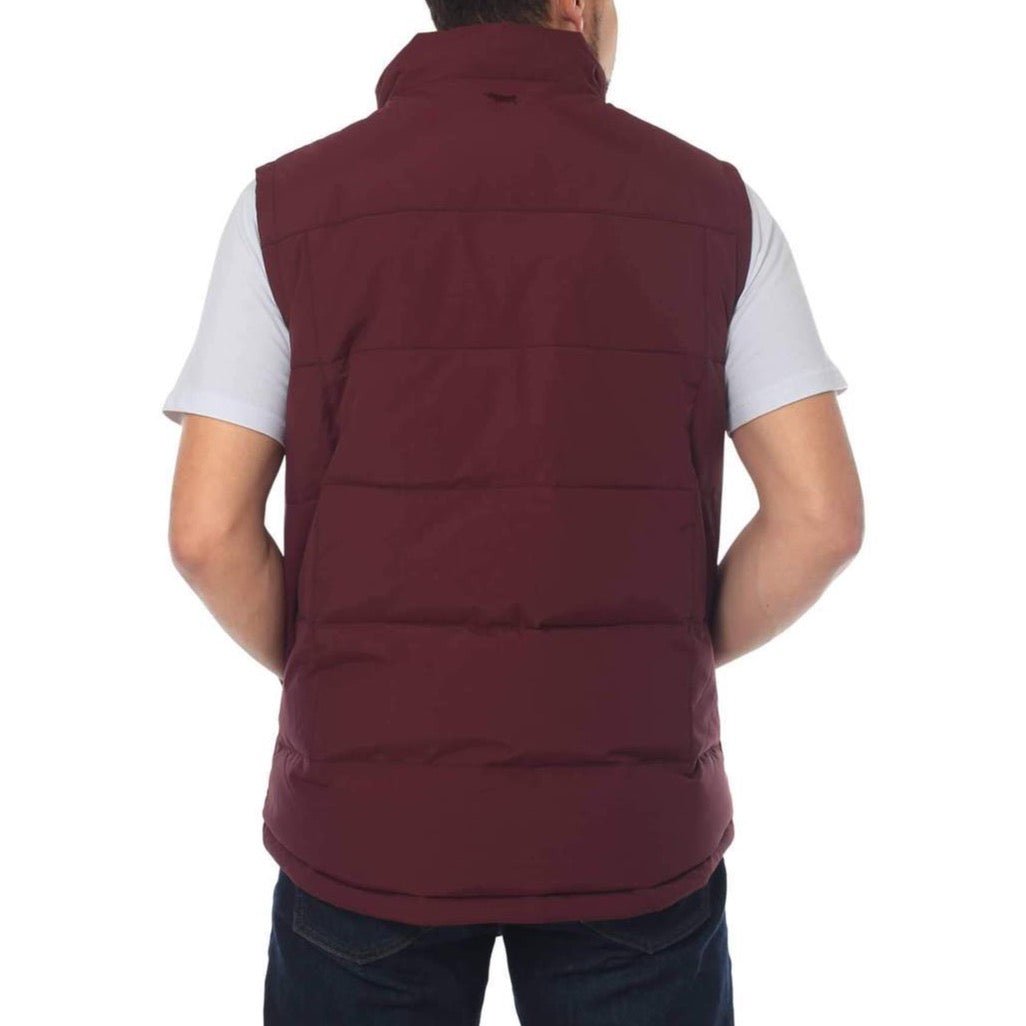 A person is shown from the back wearing a Ringers Western Horsham Puffer Vest in maroon, featuring an adjustable waist, over a light gray t-shirt and dark blue jeans. They have short hair and are standing against a plain white background.