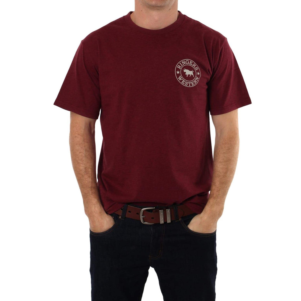 A person is standing with hands in pockets, wearing a maroon Ringers Western Signature Bull Classic T-Shirt and dark blue jeans. The comfortable crew neck T-shirt features a small, circular white logo on the upper left side, displaying a cowboy hat and the text "Ranger Westerner." Their face is not visible.