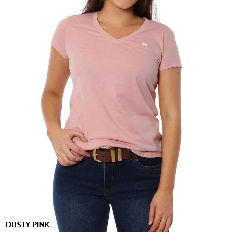 A woman wears the Ringers Western Signature Bull Relaxed V-Neck T-Shirt in dusty pink, made from 100% cotton with short sleeves and a small white logo on the left chest, paired with dark blue jeans and a brown belt against a plain white background.