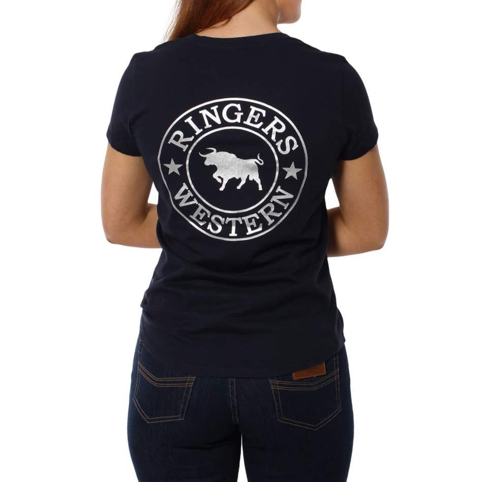 A person shown from behind wears the Ringers Western Signature Bull Relaxed V-Neck T-Shirt in navy, featuring "RINGERS WESTERN" and a white bull graphic on the back, made from 100% cotton, paired with dark jeans.