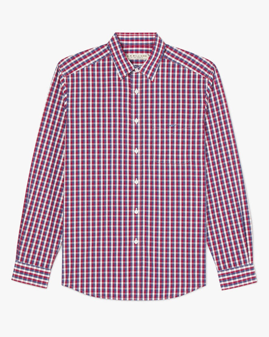 The RM Williams Collins Shirt is a long-sleeved, 100% cotton button-up with a red, white, and blue checkered pattern, pointed collar, and chest pocket.