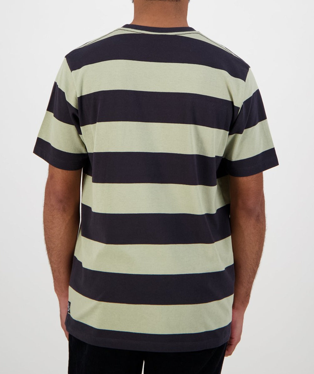 Someone is wearing a short-sleeved, 100% cotton Swanndri Tomarata Stripe Tee with black and pale green horizontal stripes, shown from the back. The clean design complements the plain white background.