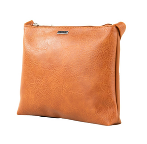 The Rusty Willow Sidebag is a light brown vinyl clutch with a zipper closure, subtle textured finish, and a small metal brand label on the front. Photographed against a white background, it offers stylish functionality.