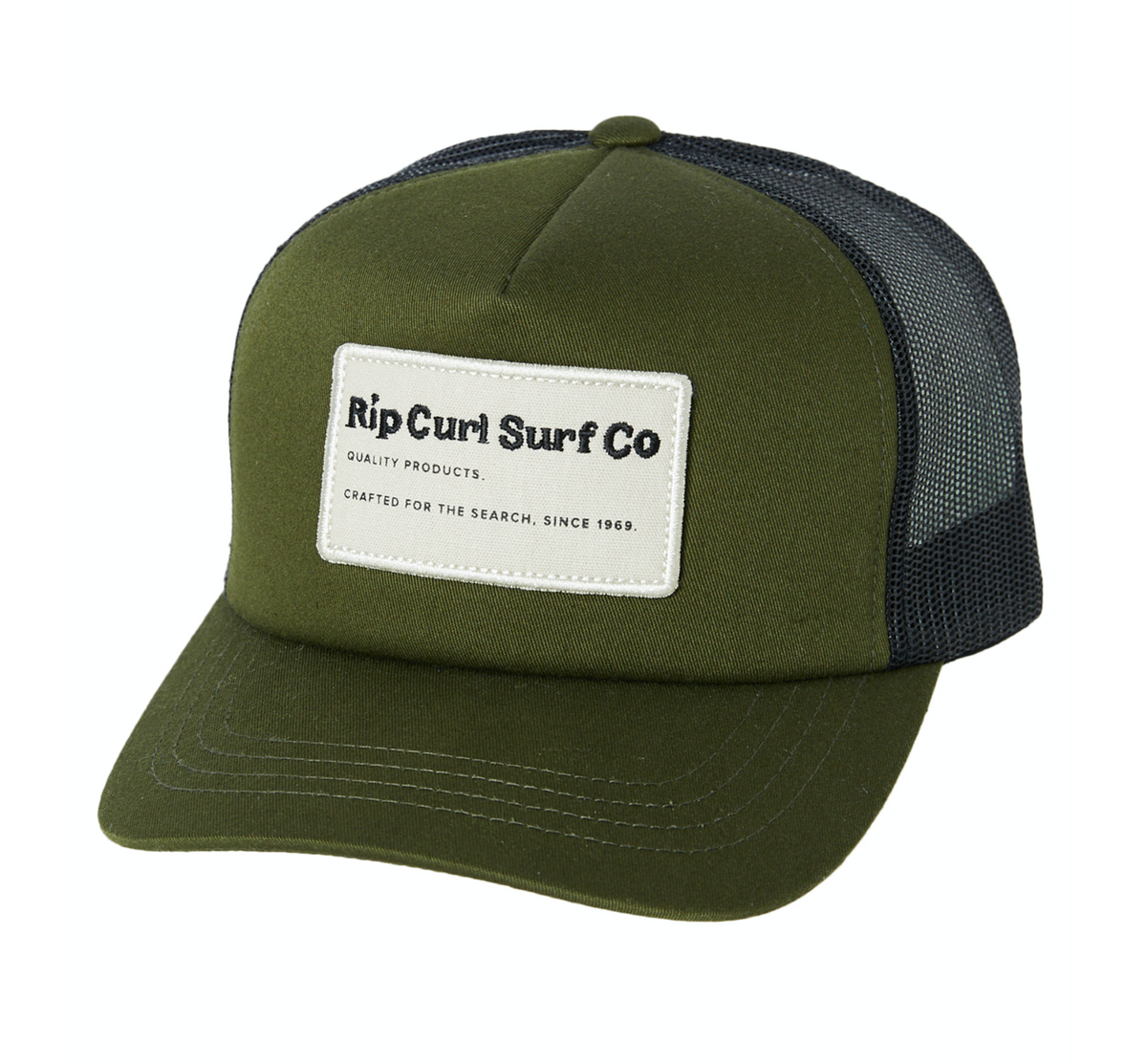 The Rip Curl SWC Trucker Hat in olive green features a black mesh back and an adjustable strap. It sports a rectangular white patch on the front panel with the text, "Rip Curl Surf Co, Quality Products, Crafted for the Search, Since 1969" in black. Made from durable cotton twill for lasting wear.