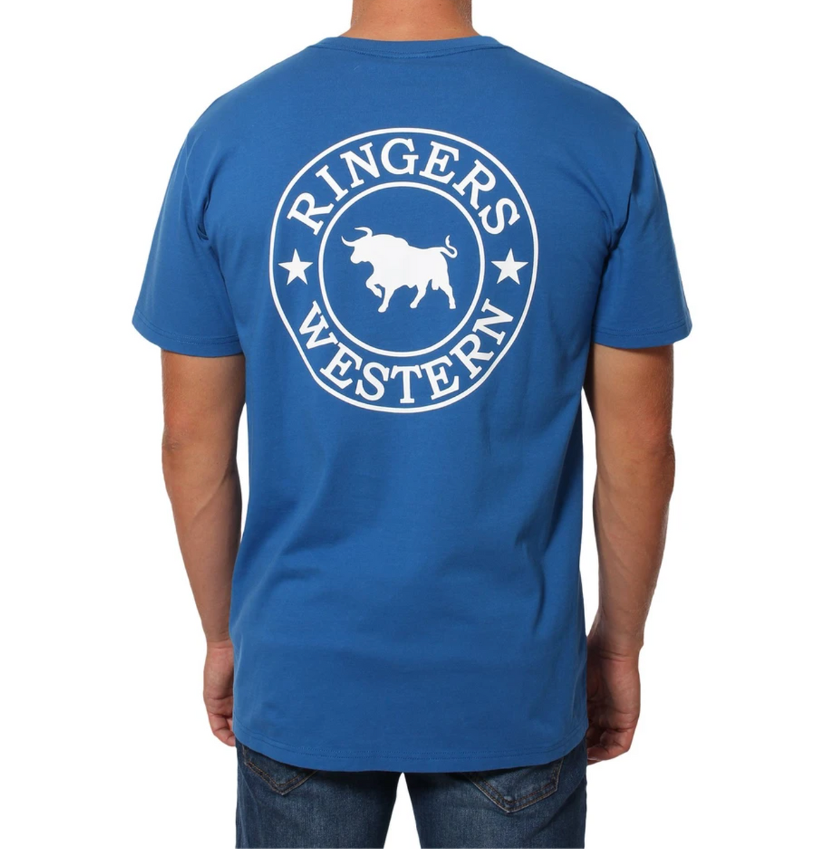A person is wearing a Ringers Western Signature Bull Classic T-Shirt, showcasing the iconic white circle with a bull silhouette and star accents on the back. They're in blue jeans, standing and facing away from the camera, highlighting their classic style.