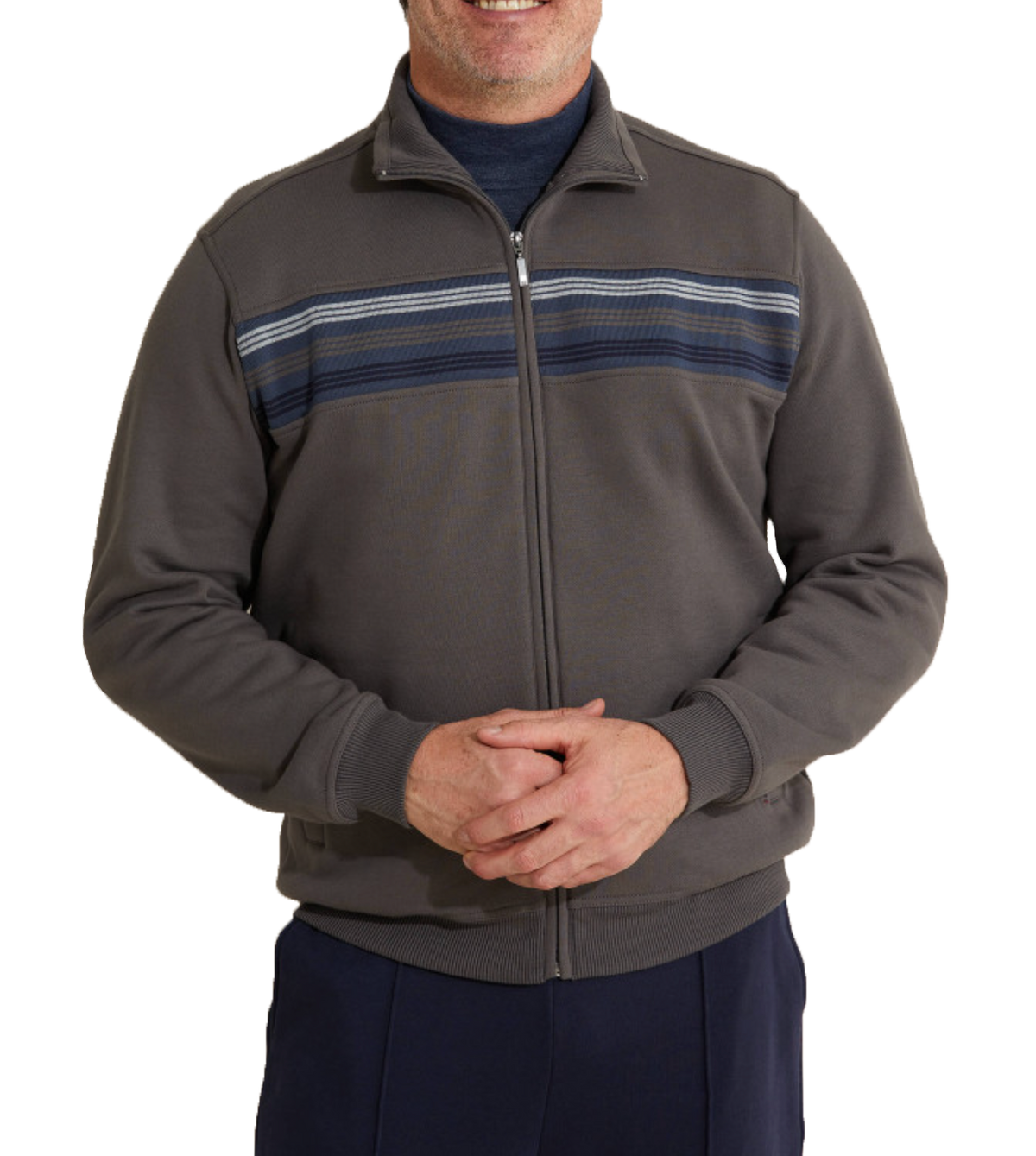 A man stands casually with hands clasped, wearing the Breakaway Hils Snowy Mt Fleece Jacket in blue horizontal stripes over a navy shirt and dark pants, set against a plain white background.
