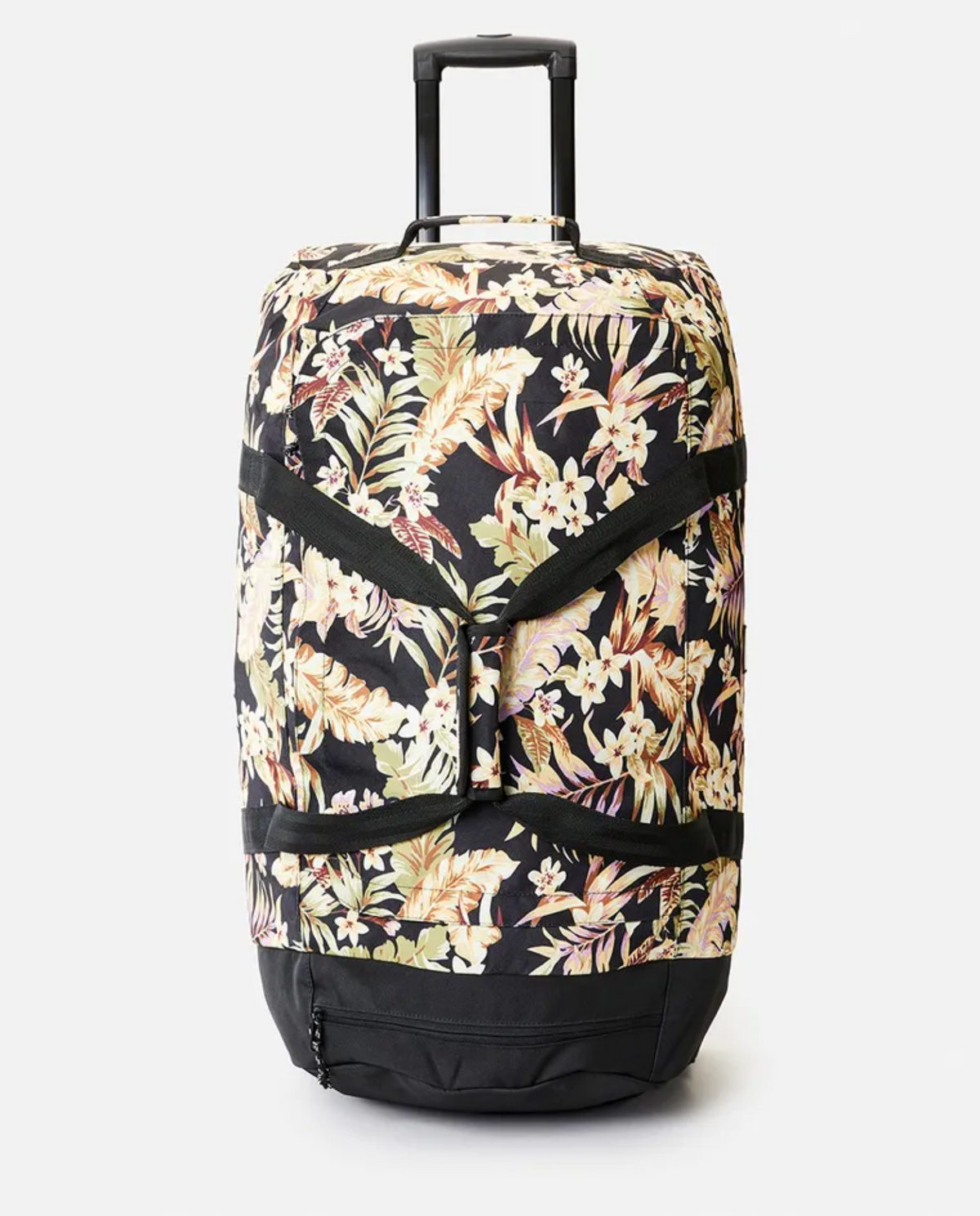 The Rip Curl Jupiter 80L Sunday Swell Travel Bag is a spacious wheeled suitcase made from recycled polyester. It features a retractable handle and vibrant tropical floral design with light flowers on a black background, standing upright on a plain white surface.