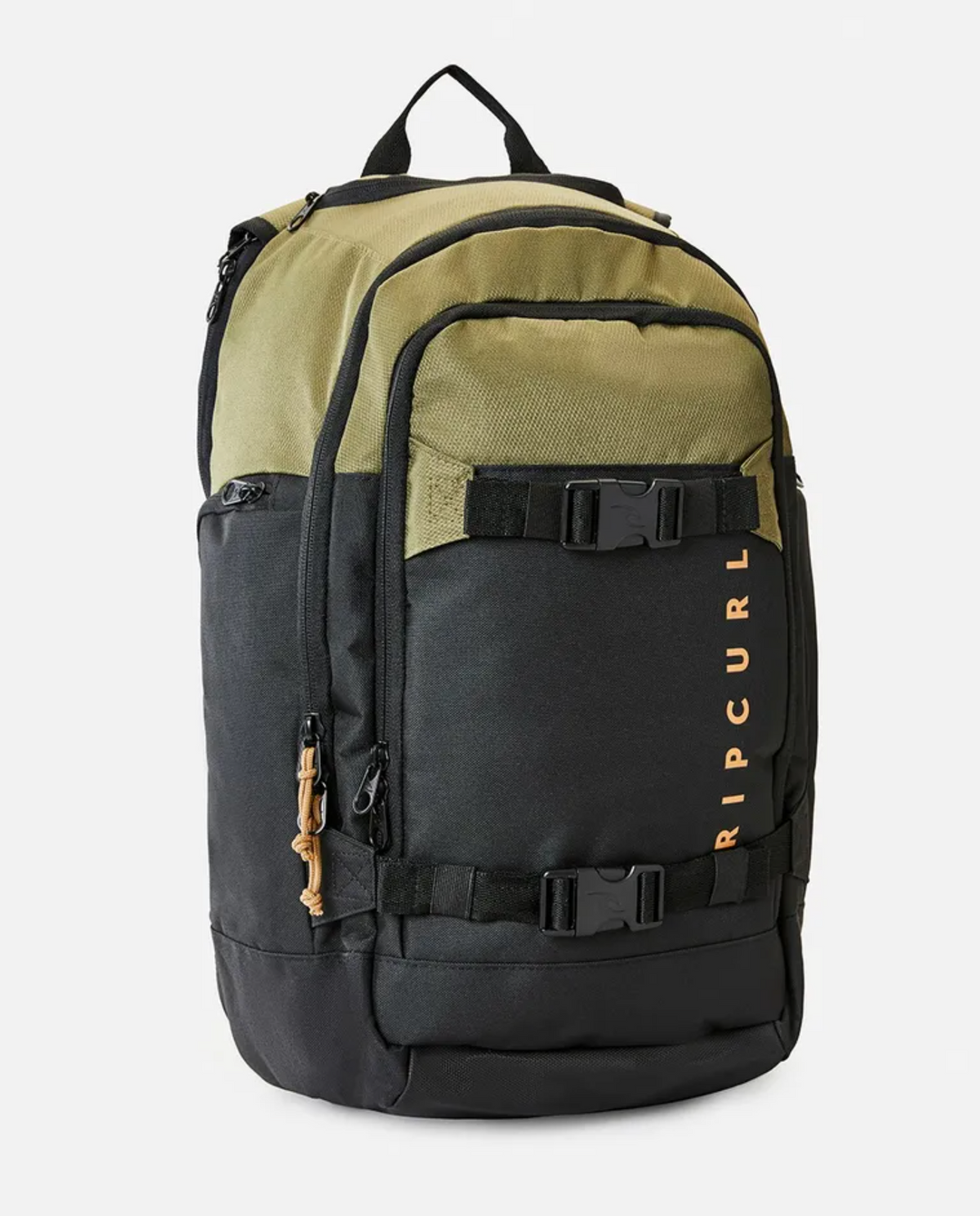 The Rip Curl Posse 33L Overland Backpack is a stylish two-tone accessory with an olive green upper section and a black lower section. Crafted from recycled polyester, it includes several zippered compartments, an internal laptop section, adjustable straps with buckles, and the "RIP CURL" brand printed vertically in orange on the front.