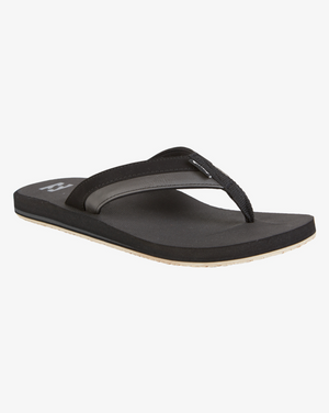 The Billabong All Day Impact Thongs consist of a single black flip-flop sandal featuring a textured rubber strap and cushioned sole against a white background. This minimalist design showcases a light-colored bottom, enhanced by its vegan nubuck material and comfort footbed.