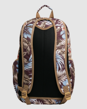 Introducing the Billabong Slow Daze Roadie Backpack—a stylish and eco-conscious accessory featuring a tropical leaf pattern in shades of brown, beige, and blue. Crafted from recycled polyester, this backpack offers padded shoulder straps for comfort, a breathable back panel, adjustable buckles on the straps, and convenient side pockets for extra storage.