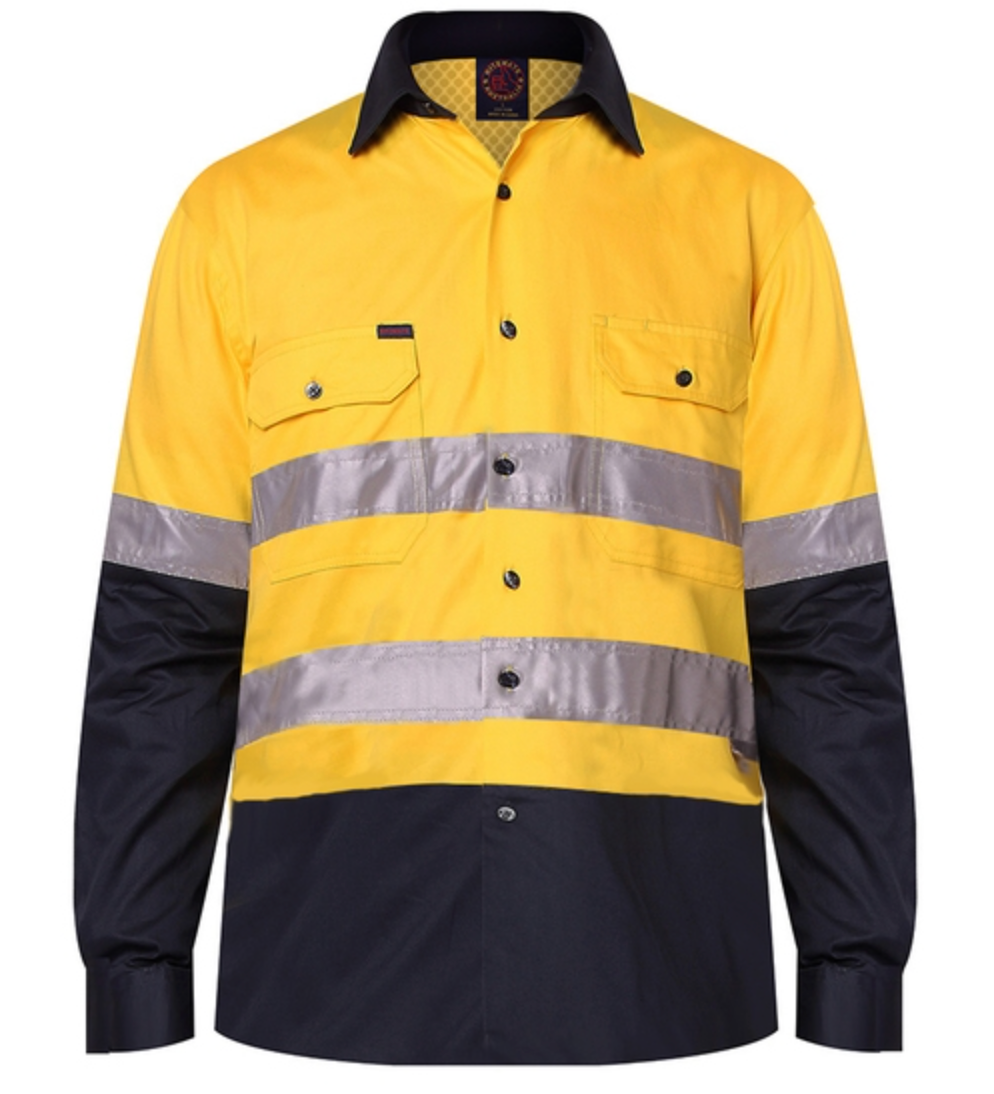 The Ritemate Hi Vis Vented Open Front Light Weight Long Sleeve 3M Tape Shirt is a high-visibility work shirt made from premium quality cotton. It features a yellow top half and navy blue bottom half, reflective strips around the chest and arms, two chest pockets with flaps, black buttons, and a black collar. The shirt is double pre-shrunk for added comfort.