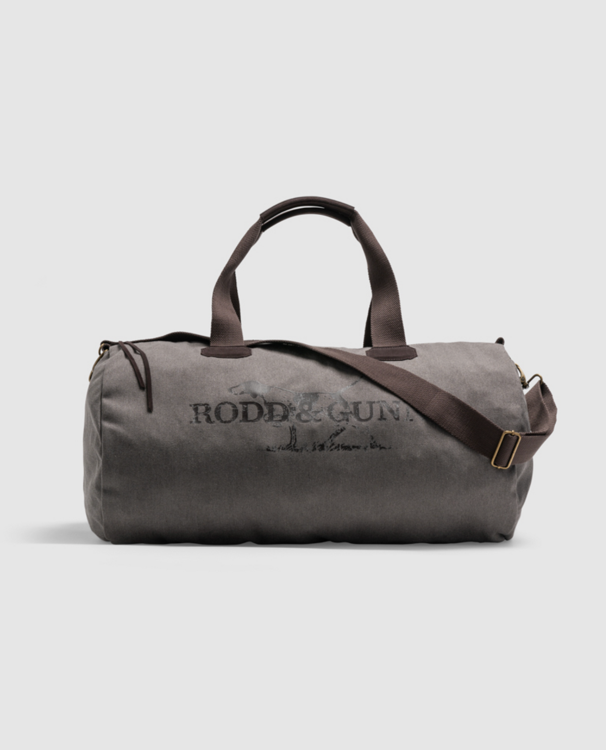 The Rodd & Gunn Double Barrel Duffle Bag is made of cotton canvas and features black handles, a brown adjustable shoulder strap, and the rustic-text logo on the front, offering both style and functionality.