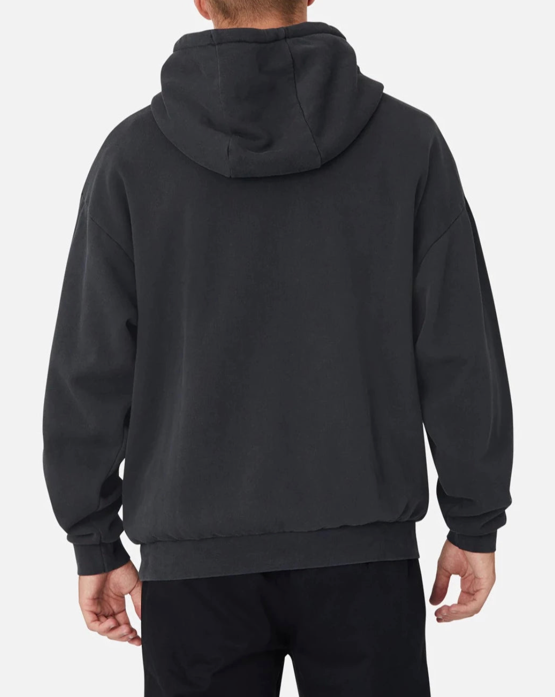 A person wearing the Industrie The Del Sur Hoodie, hood up and logo subtly visible, is facing away. They're paired with black pants against a plain white background.