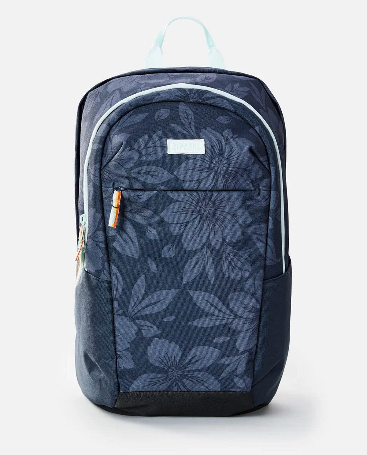 The Rip Curl Overtime 30L Backpack, made from recycled polyester, features a navy floral pattern. It includes a front zippered pocket, a roomy main compartment for a 15" laptop, light blue handle, side pockets, and an orange-accented zipper pull.