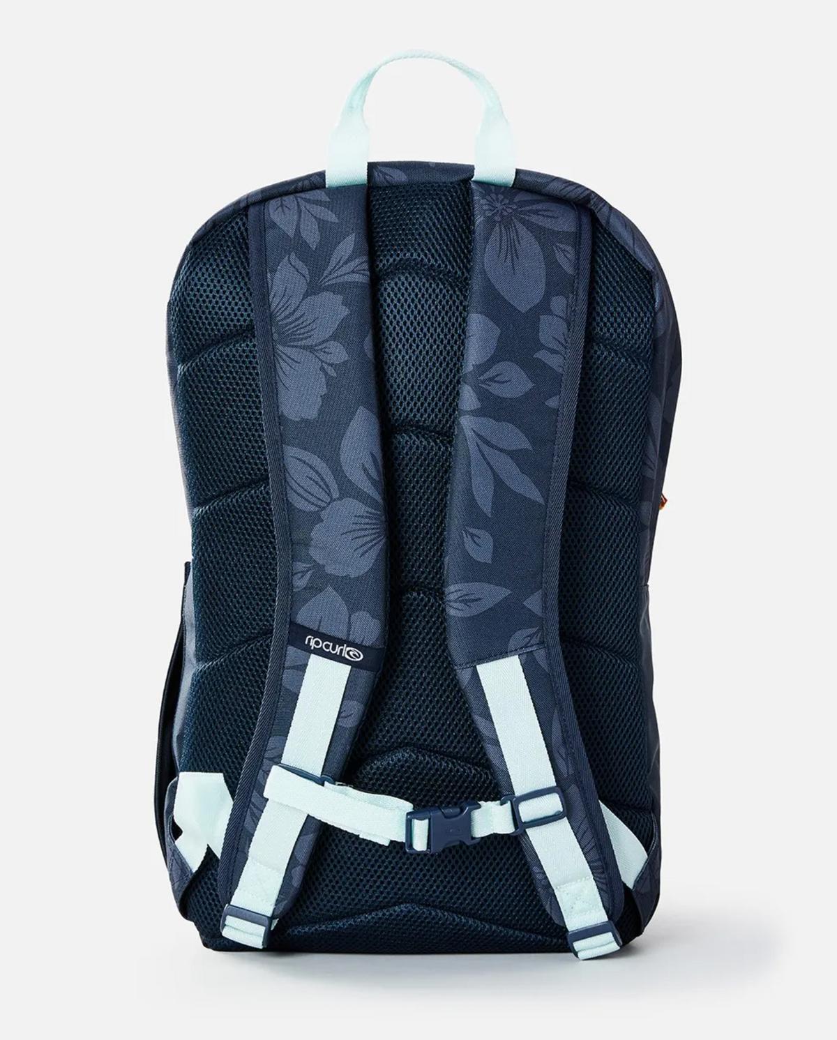 Introducing the Rip Curl Overtime 30L Backpack in navy blue with floral patterns and light blue accents. Made from recycled polyester, it offers padded back support, adjustable straps, and a 15" laptop compartment. The brand logo is displayed near the lower back area.