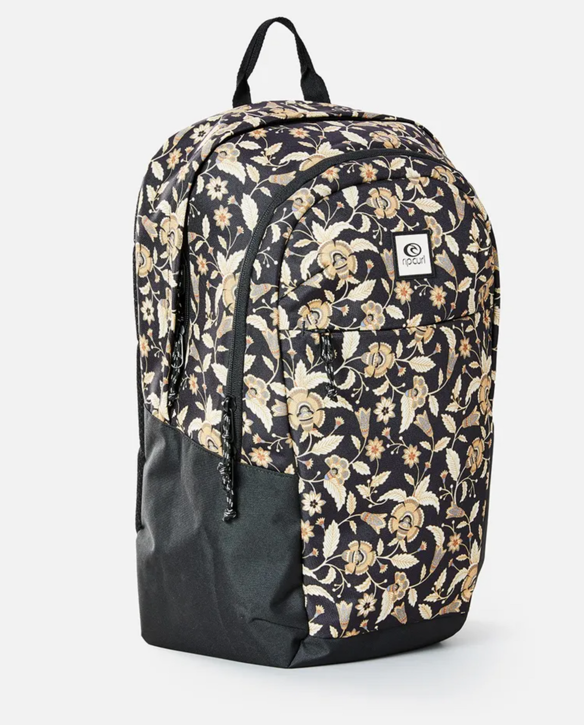The Rip Curl Overtime 30L Backpack features a black base with colorful floral patterns, made from recycled polyester. It has a small logo patch, front pocket, dual zippers, and a top handle. Compatible with 15" laptops for on-the-go convenience.
