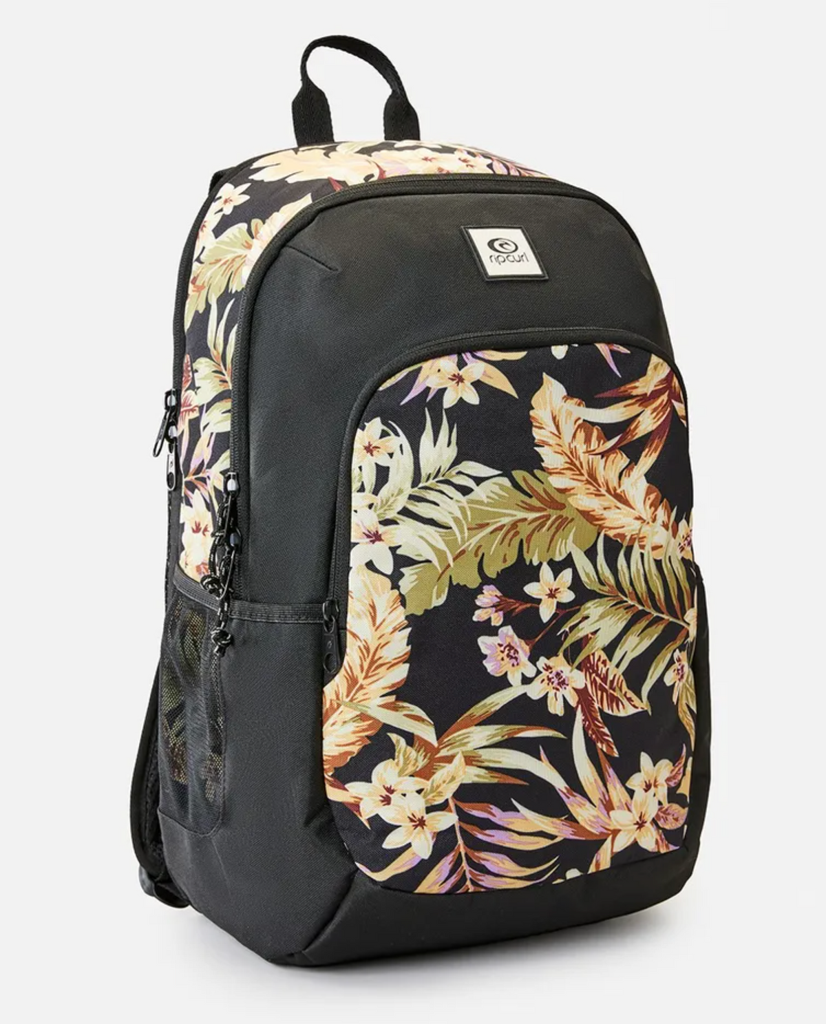 The Rip Curl Ozone 2.0 30L Backpack, made from recycled polyester, boasts a black floral print with beige and brown leaves and flowers. It includes a front pocket, side mesh pockets, top loop, and is laptop compatible, featuring a small logo patch on the front.