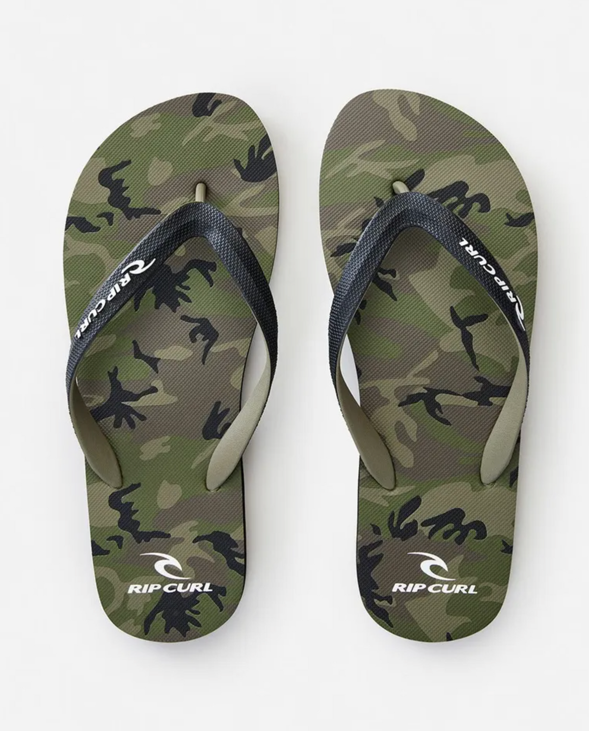 A pair of Rip Curl Camouflage Thongs with green camo print and black straps, displaying a white "Rip Curl" logo. The EVA rubber footbed has a camo pattern with "Rip Curl" and its logo printed in white near the heels.