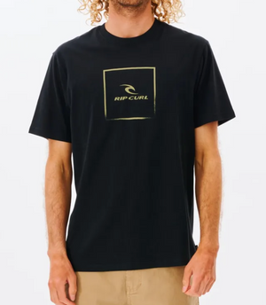 A man wearing a Rip Curl Corp Icon Tee, a casual black T-shirt made from 100% cotton.