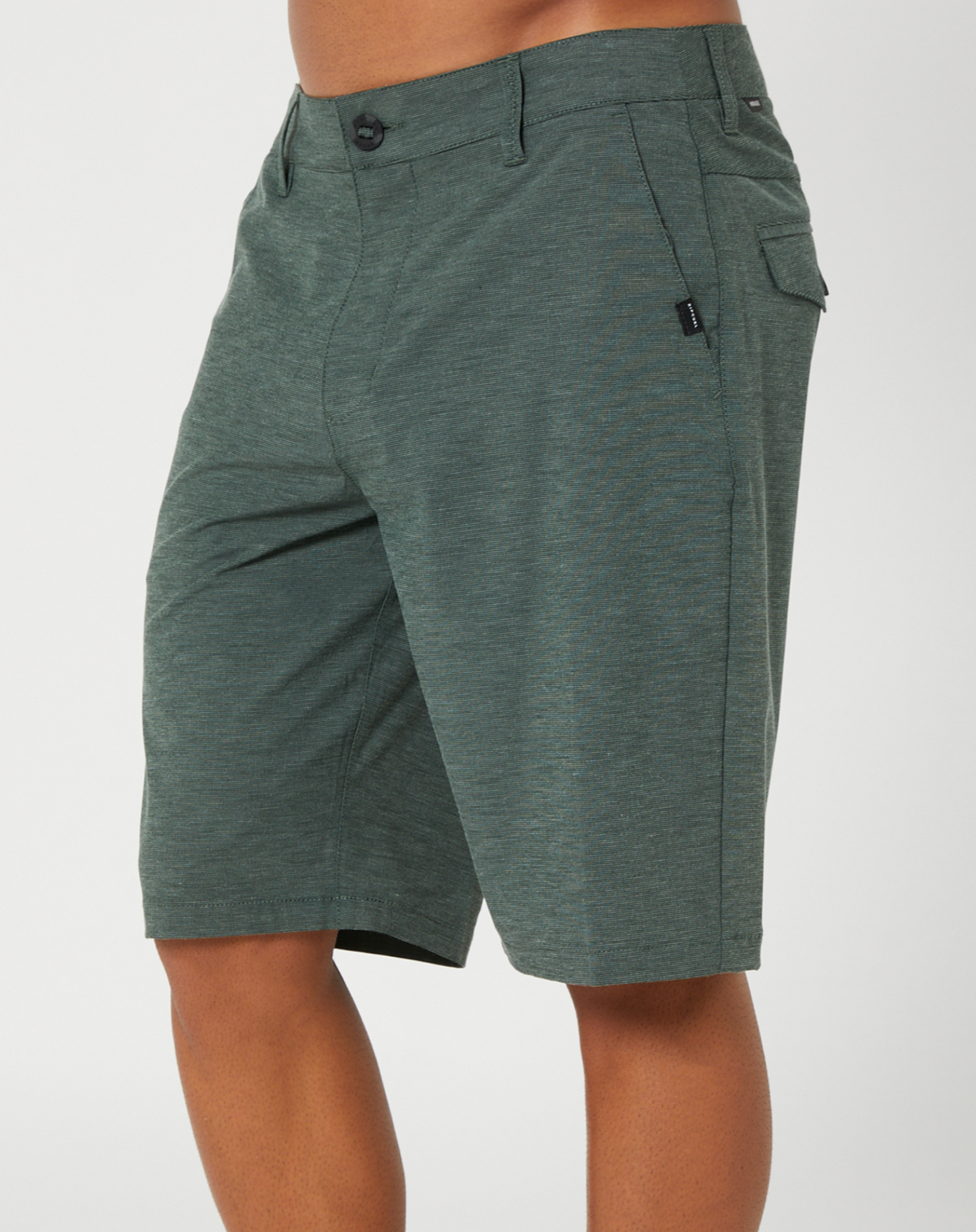 A person wears Rip Curl Boardwalk Phase Short in green, knee-length with quick-dry fabric, button and zip closure, and a convenient right-side pocket against a plain background.