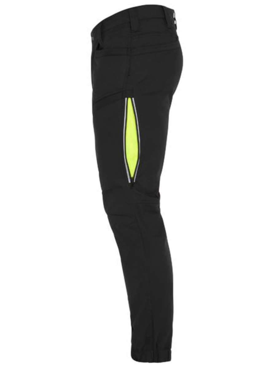 The side view of the Bisley X Airflow Stretch Ripstop Vented Cuffed Pant showcases a vertical zipper pocket with a neon yellow interior detail on the thigh. Made from stretch ripstop fabric, these comfortable pants feature a slim-fit design tailored for athletic or outdoor activities, with a bottom hem that fits snugly around the ankle.