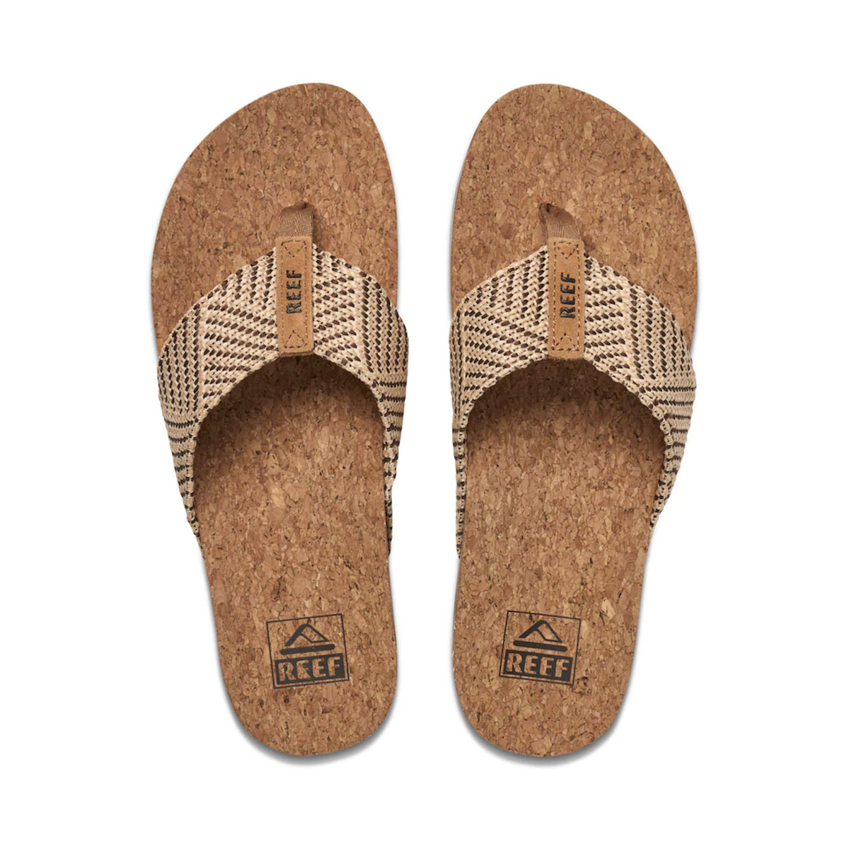 Experience ultimate comfort with the REEF Cushion Strand sandals, featuring cork soles and woven beige and black straps. The cushion bounce midsole offers exceptional arch support, while the logo adds a stylish touch to both the straps and heel area.