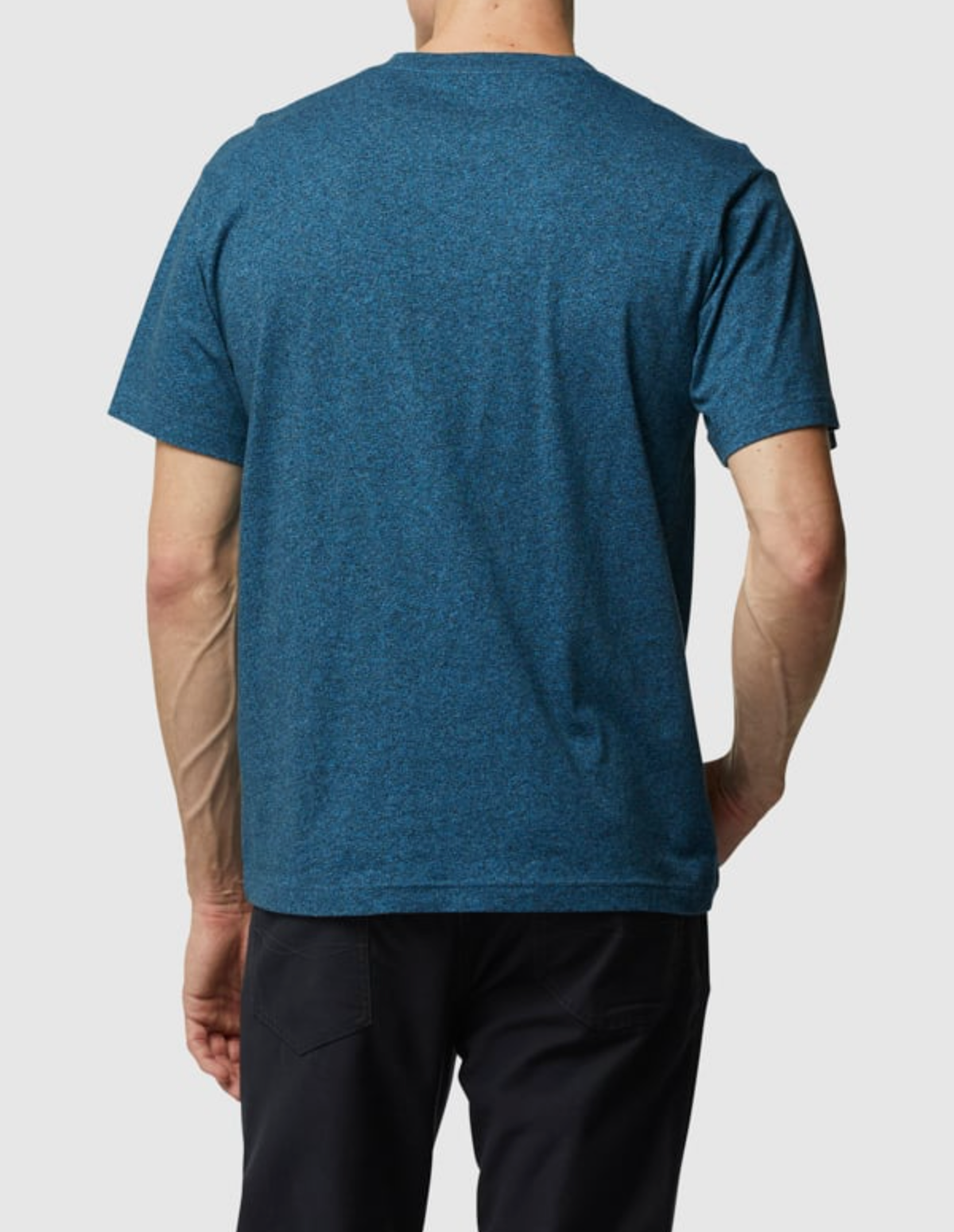 A person is seen from behind wearing the Rodd & Gunn The Gunn T-Shirt in blue, made with Australian Cotton, paired with black pants, set against a plain white background.