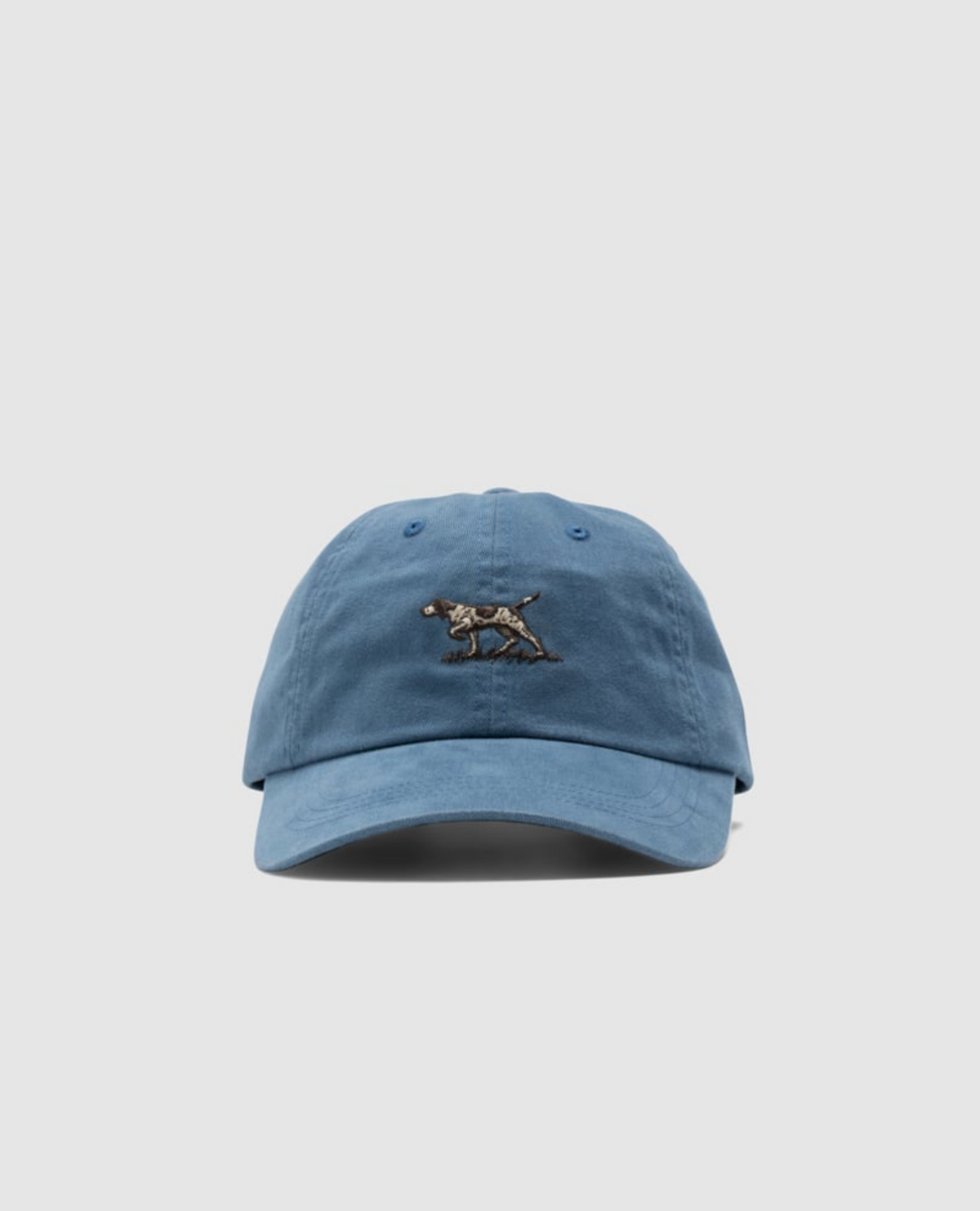 The Rodd & Gunn Signature Cap is a blue cotton twill baseball cap with an embroidered dog logo on a white background and includes an adjustable strap for the perfect fit.