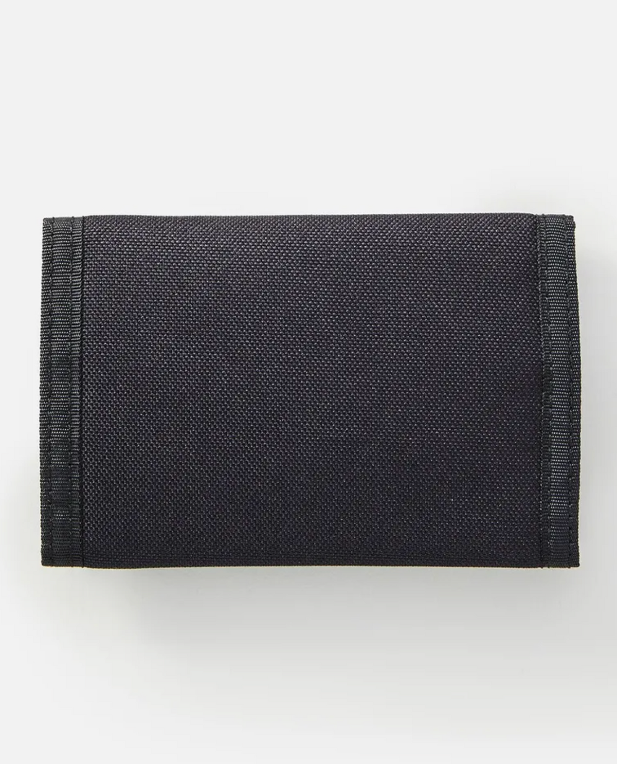 A close-up of the folded Rip Curl Surf Revival Surf Wallet in black, made from recycled polyester with stitched edges, set against a plain white background.