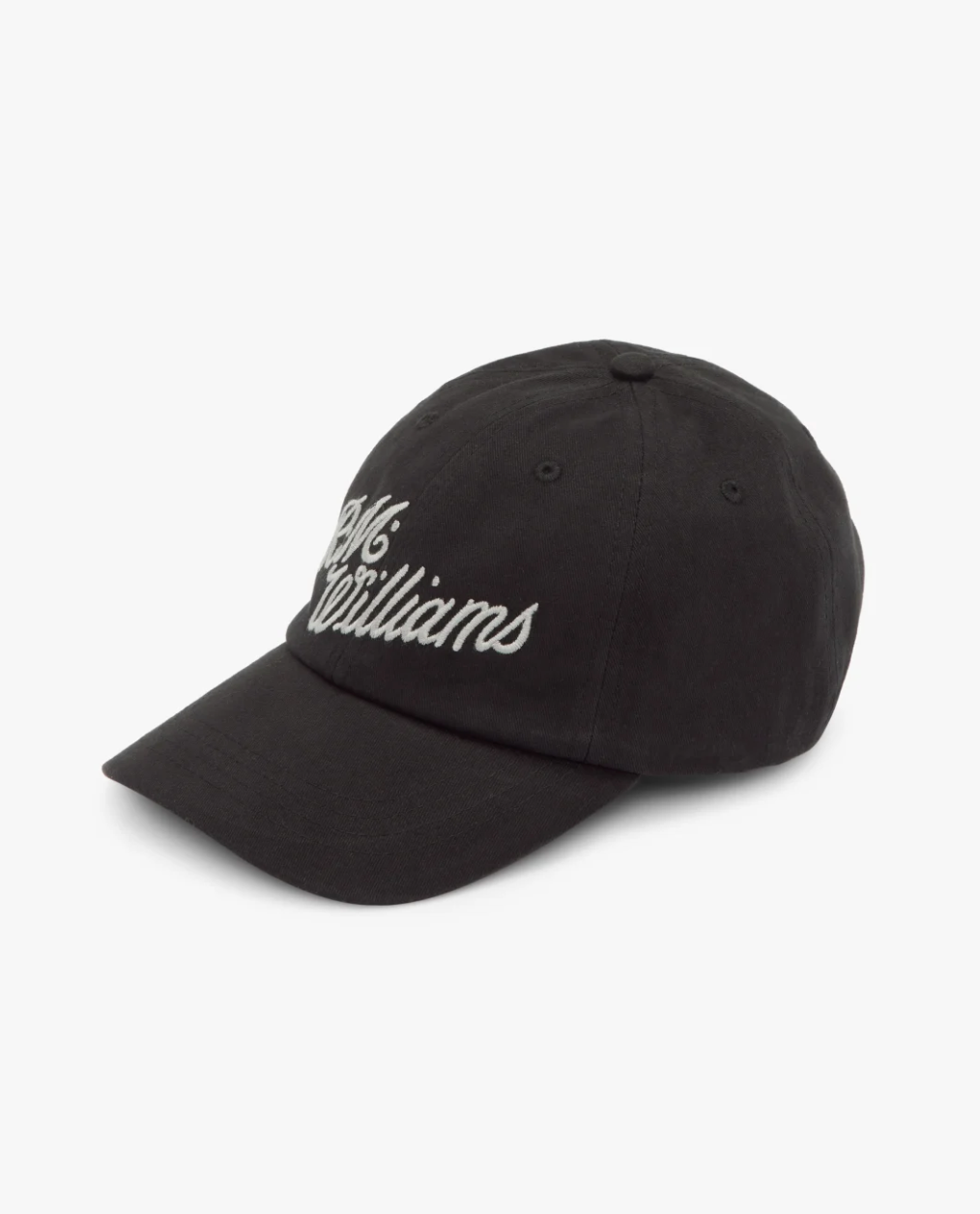 The RM Williams Script Cap is a black cotton twill cap with white cursive "McWilliams" embroidery. It features a curved brim, classic six-panel design, and an adjustable strap for a perfect fit.
