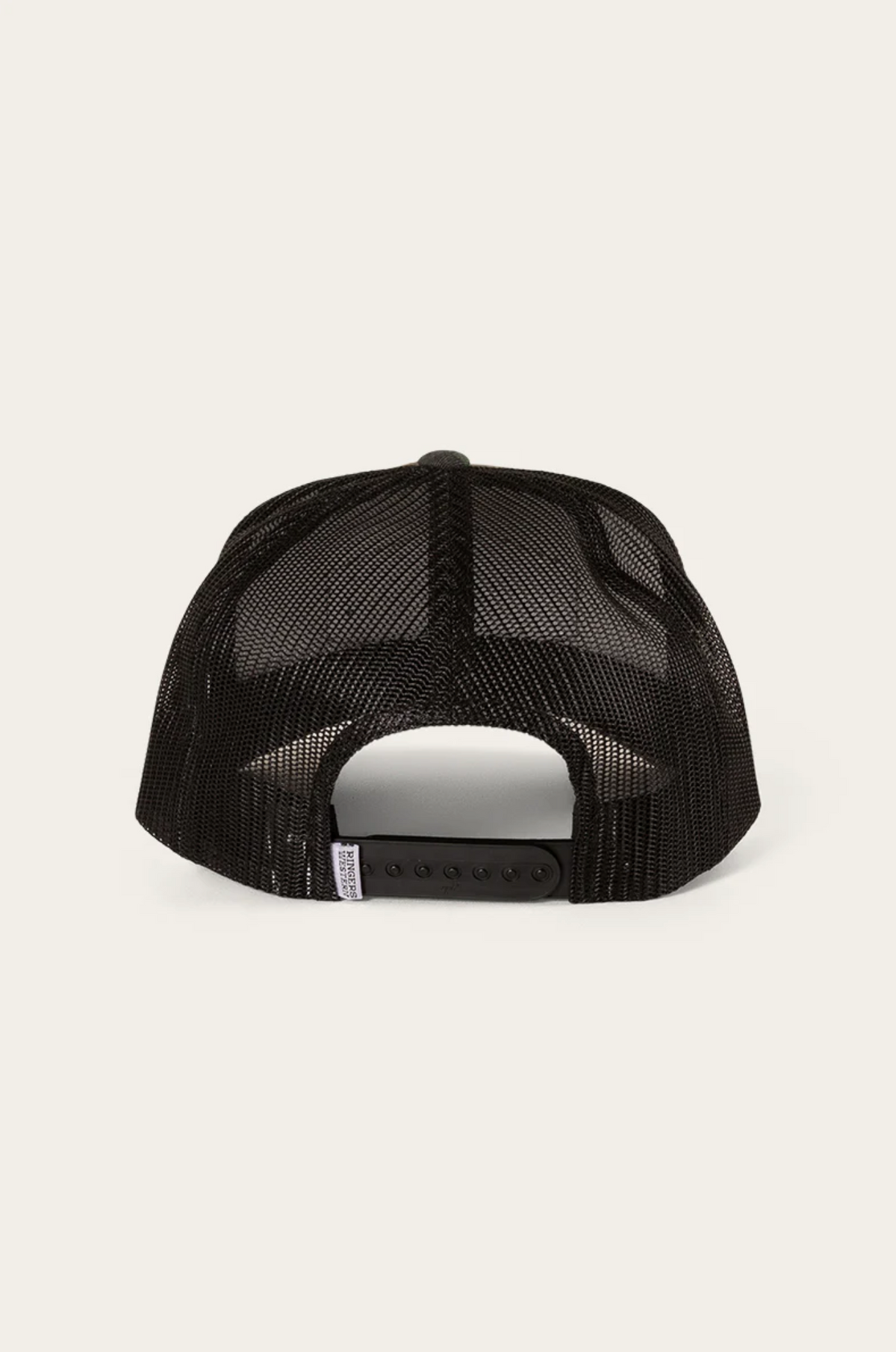 The Ringers Western Scotty Trucker Cap, featuring a black mesh rear view with an adjustable snapback closure, crafted from high-quality cotton twill for comfort and durability, is set against a plain light background.