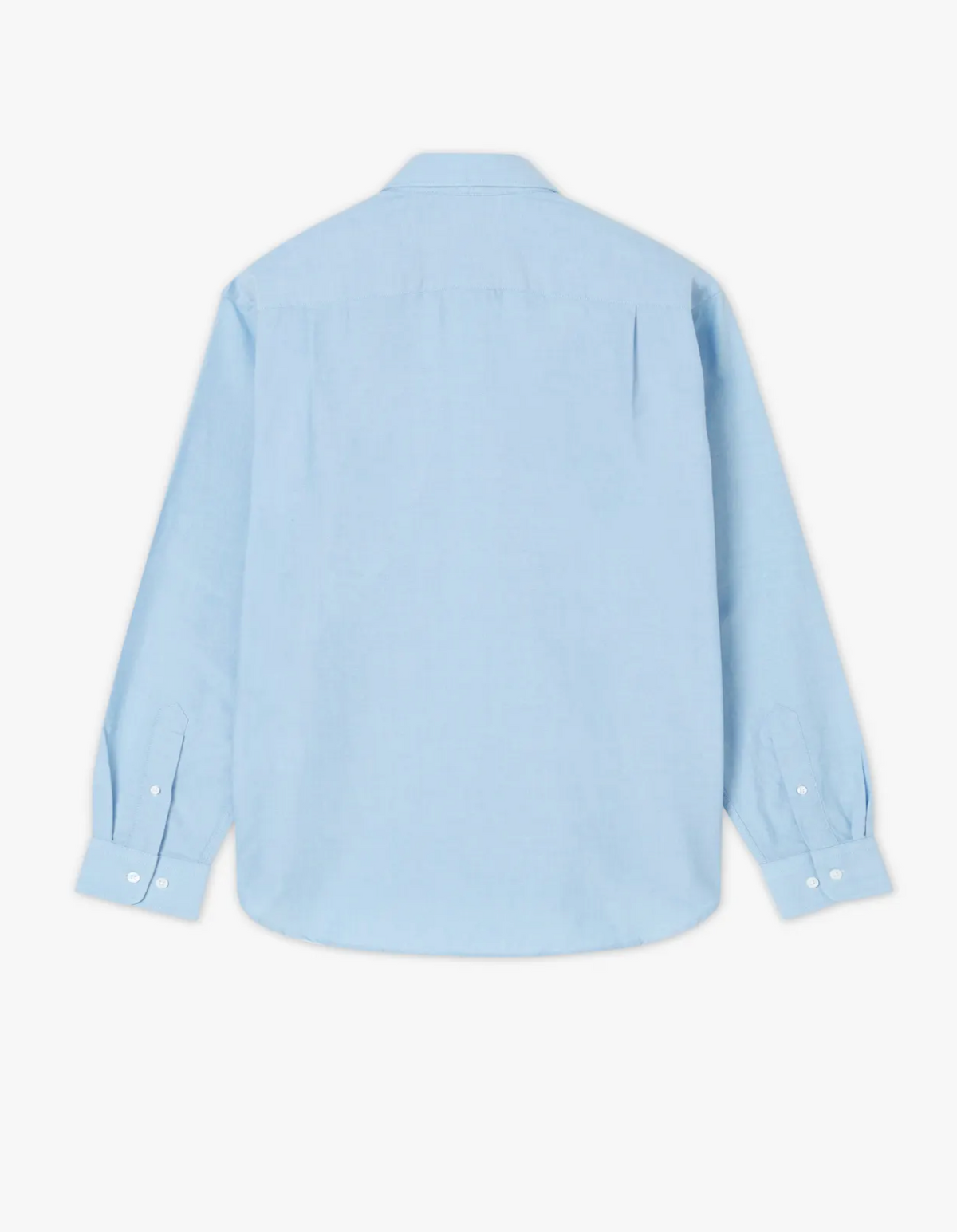 The RM Williams Collins Shirt in light blue oxford cotton is displayed from the back on a white background, featuring a classic collar, buttoned cuffs, and subtle Longhorn embroidery.