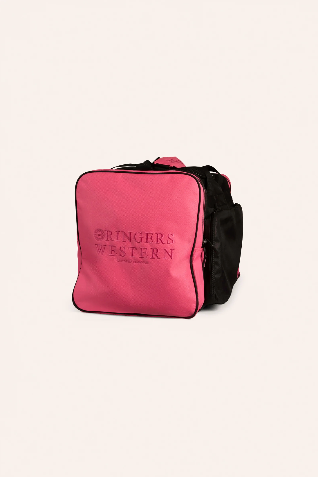 A Ringers Western Rider Sports Bag in black and pink, shaped square, with "RINGERS WESTERN" embroidered on the front pink panel. The sports bag includes zippered compartments, side pockets, and black straps and detailing against a neutral off-white background.