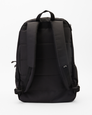 The Billabong Command Backpack, made from recycled polyester, is black and features padded shoulder straps, a top handle, and multiple compartments including a laptop section. It contrasts strikingly against a white background.