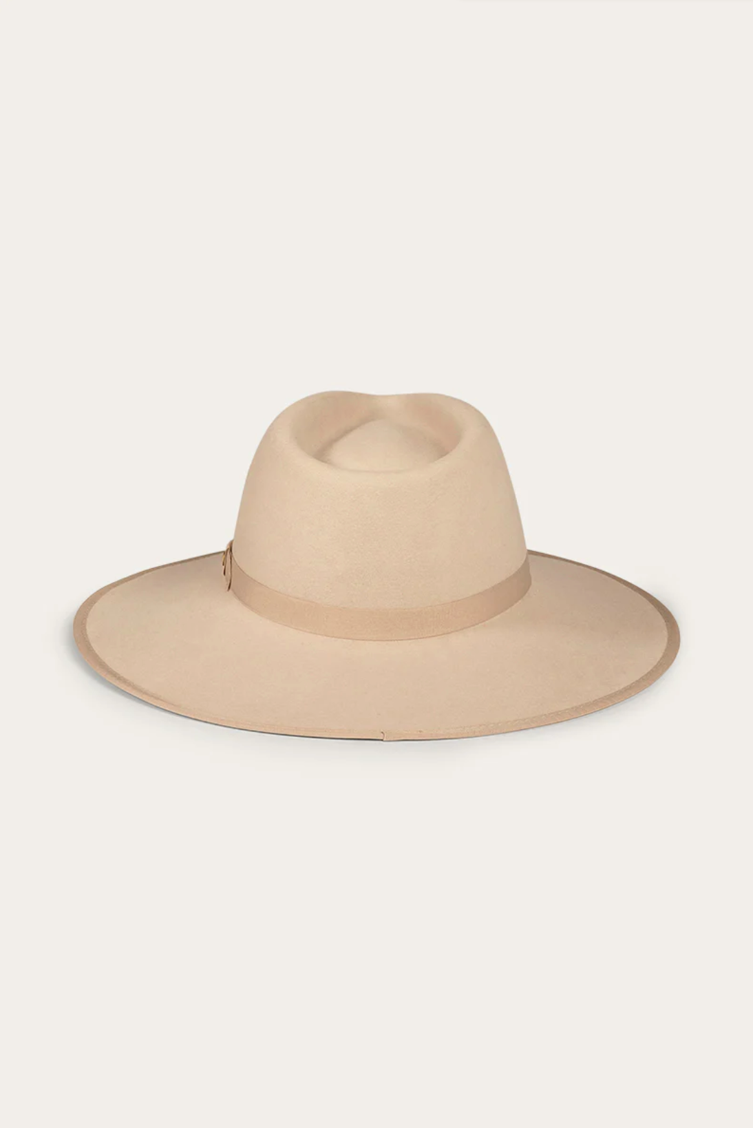 The Ringers Western Woodford Hat is a beige wide-brimmed fedora crafted from premium felt, featuring a matching grosgrain ribbon around the crown, set against a plain background.